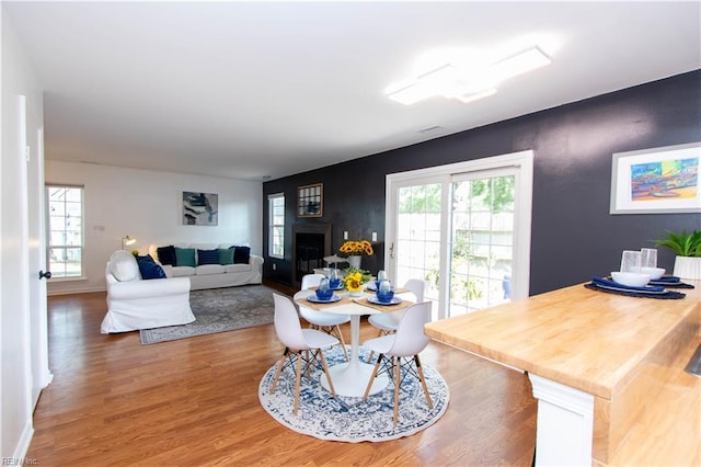 4510 Indies Ct, Virginia Beach, VA 23462 - dining space with light wood-style flooring and a fireplace