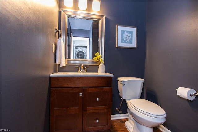 4510 Indies Ct, Virginia Beach, VA 23462 - bathroom with toilet, baseboards, vanity, and washer / clothes dryer