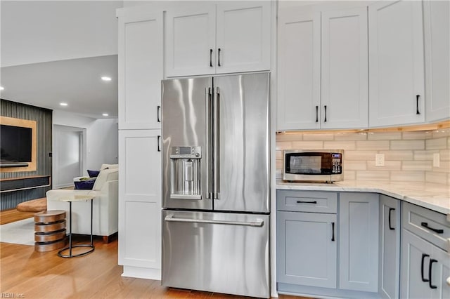 808 High Point Ave, Virginia Beach, VA 23451 - kitchen with stainless steel appliances, light stone counters, light wood-style flooring, tasteful backsplash, and gray cabinetry