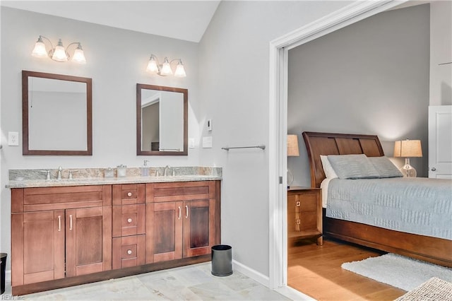 808 High Point Ave, Virginia Beach, VA 23451 - ensuite bathroom featuring double vanity, lofted ceiling, and baseboards