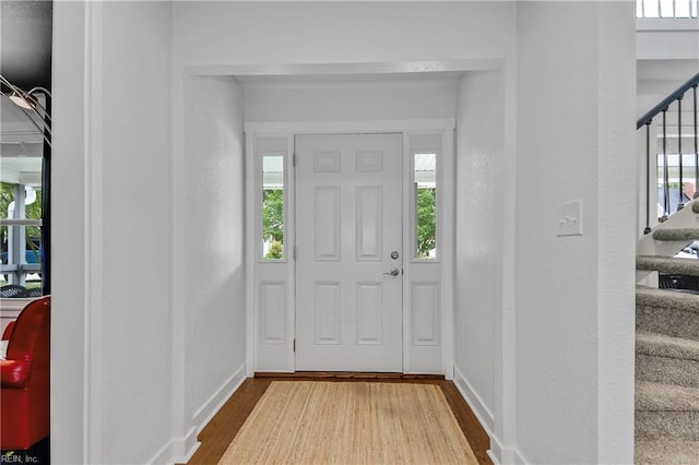 808 High Point Ave, Virginia Beach, VA 23451 - entrance foyer featuring wood finished floors, stairway, and healthy amount of natural light