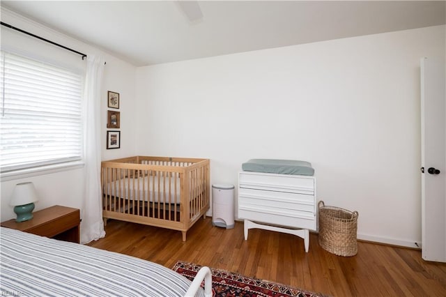 2522 Jasper Ct, Norfolk, VA 23518 - bedroom featuring wood finished floors and a crib