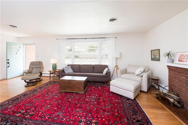 2522 Jasper Ct, Norfolk, VA 23518 - living room with wood finished floors and a baseboard radiator