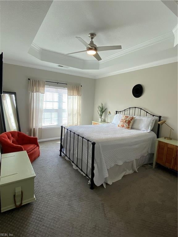 1010 Kings Land Ct, Williamsburg, VA 23185 - bedroom with a tray ceiling, ornamental molding, carpet floors, and a ceiling fan