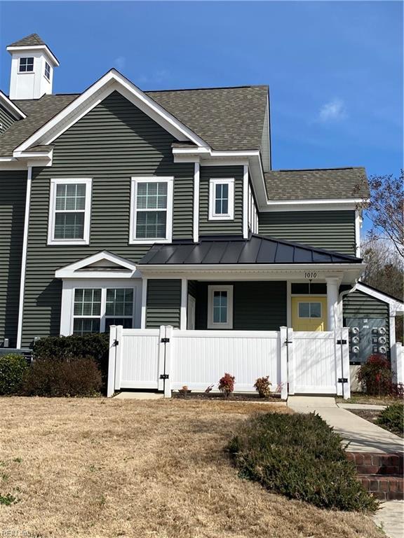 1010 Kings Land Ct, Williamsburg, VA 23185 - view of front of property with a shingled roof, a gate, a standing seam roof, a metal roof, and a porch