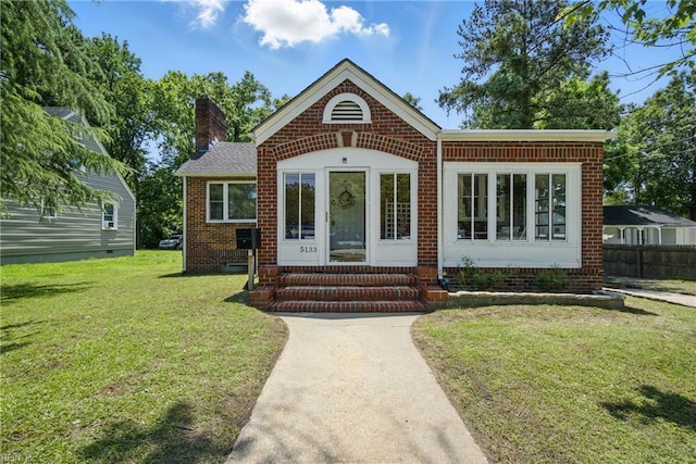 5133 E Princess Anne Rd, Norfolk, VA 23502 - view of front of property featuring entry steps, brick siding, and a chimney
