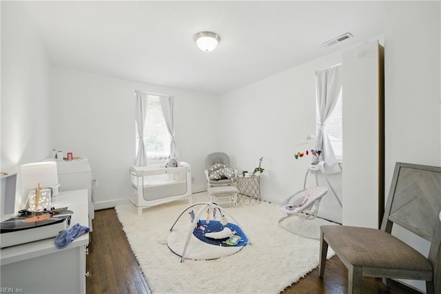 5133 E Princess Anne Rd, Norfolk, VA 23502 - living area with dark wood-style floors and baseboards