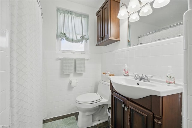 5133 E Princess Anne Rd, Norfolk, VA 23502 - full bathroom with tile walls, vanity, toilet, a shower with shower curtain, and wainscoting