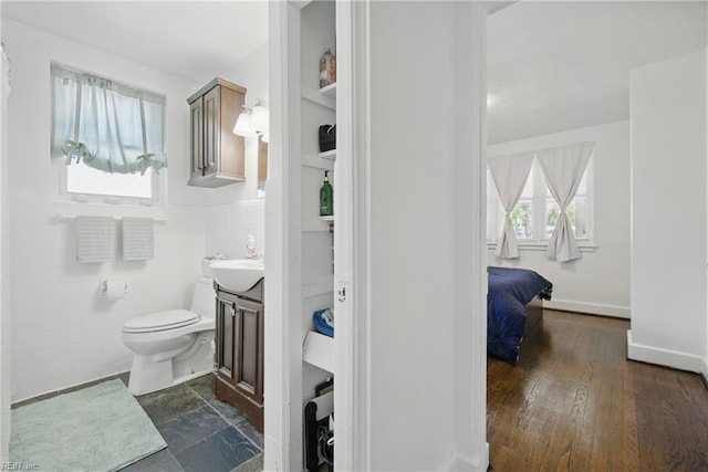 5133 E Princess Anne Rd, Norfolk, VA 23502 - bathroom with plenty of natural light, vanity, toilet, and baseboards