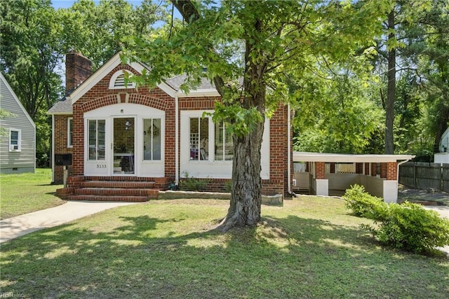 5133 E Princess Anne Rd, Norfolk, VA 23502 - view of front facade featuring entry steps, brick siding, a front yard, and a chimney