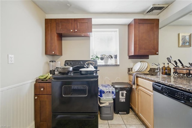 5133 E Princess Anne Rd, Norfolk, VA 23502 - kitchen featuring stainless steel dishwasher, black electric range oven, a wainscoted wall, light tile patterned floors, and dark stone counters