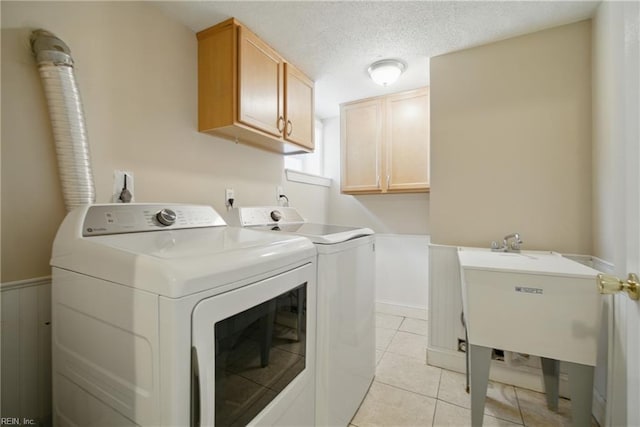 5133 E Princess Anne Rd, Norfolk, VA 23502 - washroom with cabinet space, separate washer and dryer, and light tile patterned floors