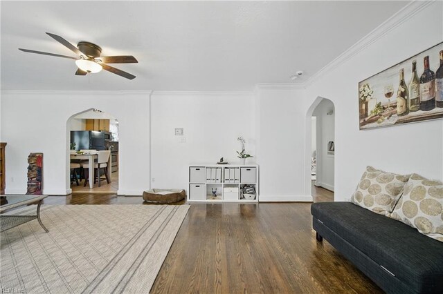 5133 E Princess Anne Rd, Norfolk, VA 23502 - living room featuring arched walkways, ceiling fan, crown molding, wood finished floors, and baseboards