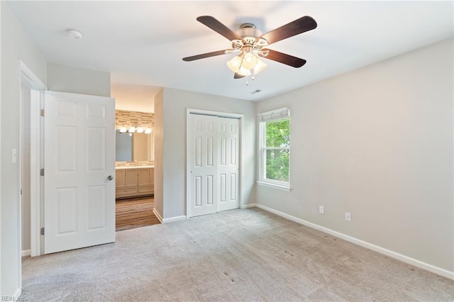 230 Abingdon Cir, Suffolk, VA 23434 - unfurnished bedroom featuring baseboards, carpet flooring, a closet, a ceiling fan, and ensuite bath