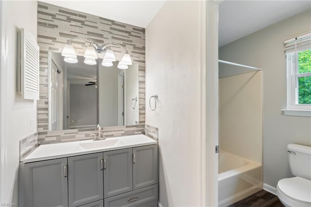 230 Abingdon Cir, Suffolk, VA 23434 - full bath with toilet, vanity, shower / bathtub combination, decorative backsplash, and baseboards