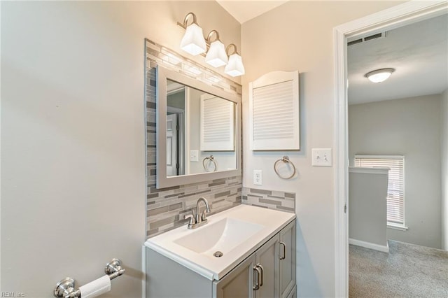230 Abingdon Cir, Suffolk, VA 23434 - bathroom featuring backsplash, vanity, and baseboards