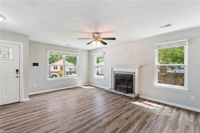 230 Abingdon Cir, Suffolk, VA 23434 - unfurnished living room featuring dark wood finished floors, ceiling fan, baseboards, and a fireplace with raised hearth
