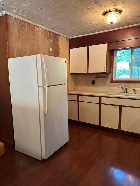 5216 Hemlock Rd, Quinton, VA 23141 - kitchen featuring freestanding refrigerator, a sink, white cabinetry, dark wood finished floors, and light countertops
