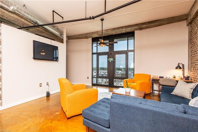 415 Saint Pauls Blvd Unit 702, Norfolk, VA 23510 - living area featuring baseboards, finished concrete flooring, and a ceiling fan