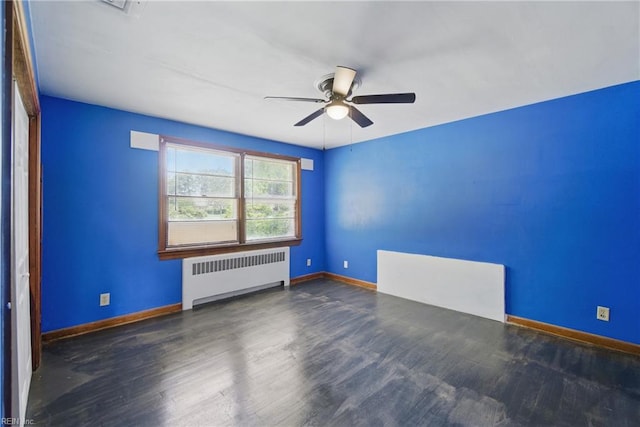 3555 Heutte Dr, Norfolk, VA 23518 - empty room featuring radiator, ceiling fan, wood finished floors, and baseboards