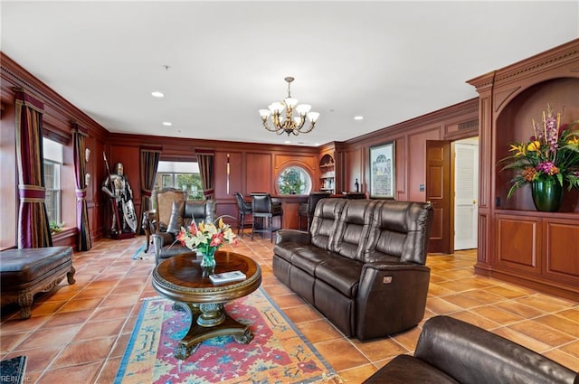 3248 Page Ave Unit 203, Virginia Beach, VA 23451 - living area with a chandelier, crown molding, recessed lighting, light tile patterned floors, and a decorative wall