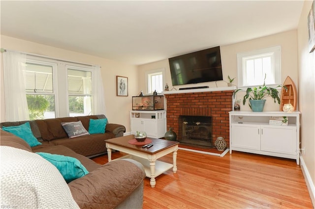 327 Brightwood Ave, Hampton, VA 23661 - living room with light wood-style flooring and a fireplace