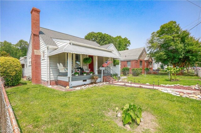 327 Brightwood Ave, Hampton, VA 23661 - bungalow-style house with covered porch and a chimney