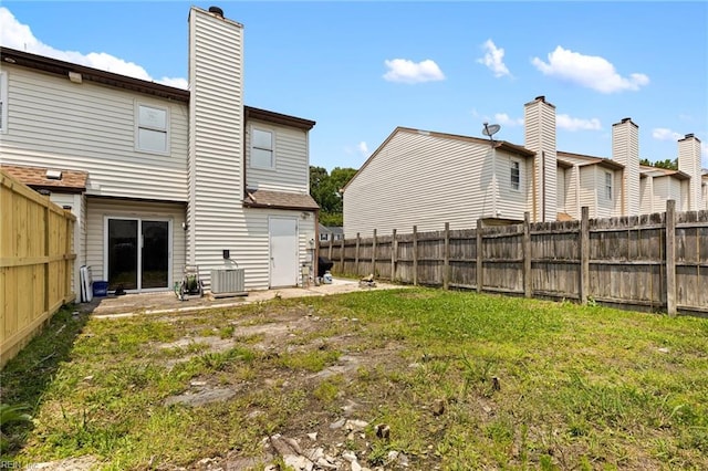 560 Davis St, Virginia Beach, VA 23462 - rear view of house with a chimney and central AC unit
