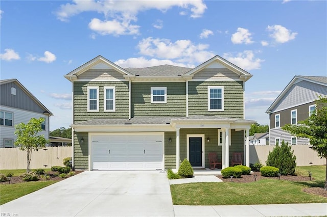 1906 Briton Ln, Chesapeake, VA 23322 - view of front facade featuring driveway, an attached garage, covered porch, and a shingled roof