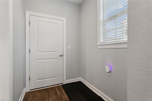 1906 Briton Ln, Chesapeake, VA 23322 - doorway with baseboards and dark wood finished floors