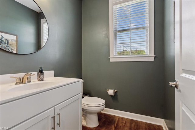1906 Briton Ln, Chesapeake, VA 23322 - half bath featuring vanity, wood finished floors, toilet, and baseboards
