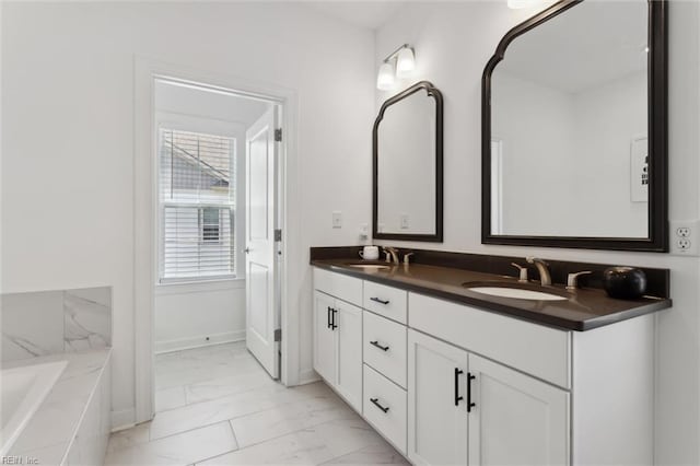 1906 Briton Ln, Chesapeake, VA 23322 - bathroom with marble finish floors, double vanity, a tub, and baseboards
