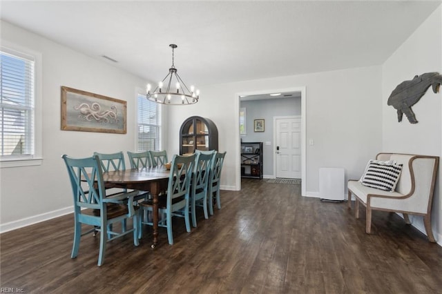 1906 Briton Ln, Chesapeake, VA 23322 - dining room featuring a chandelier, dark wood-style floors, and baseboards