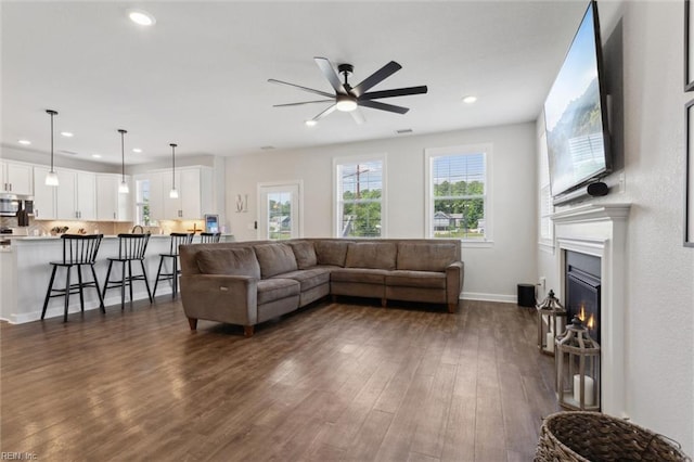 1906 Briton Ln, Chesapeake, VA 23322 - living area with a ceiling fan, recessed lighting, dark wood-type flooring, a glass covered fireplace, and baseboards