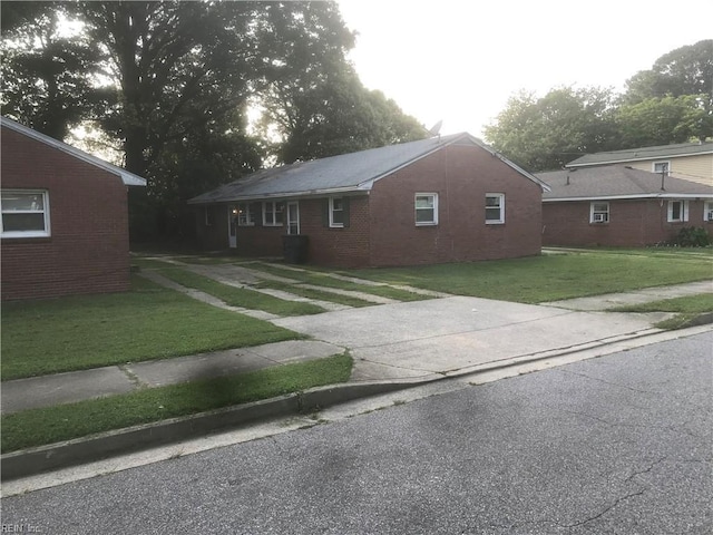 3227 Vimy Ridge Ave, Norfolk, VA 23509 - view of front of house featuring a front yard and brick siding