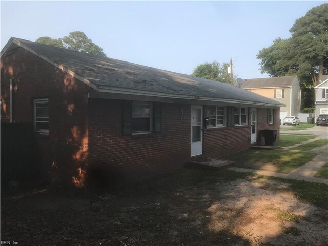 3227 Vimy Ridge Ave, Norfolk, VA 23509 - view of side of home with brick siding and a shingled roof
