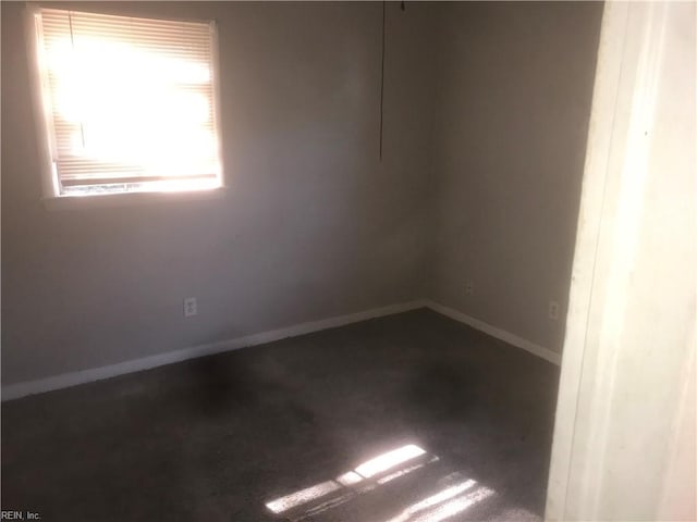 3227 Vimy Ridge Ave, Norfolk, VA 23509 - unfurnished room with dark carpet and baseboards