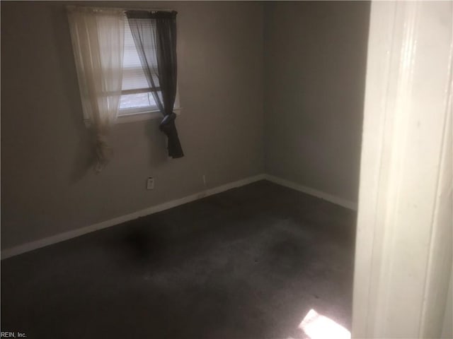 3227 Vimy Ridge Ave, Norfolk, VA 23509 - spare room with baseboards and dark colored carpet