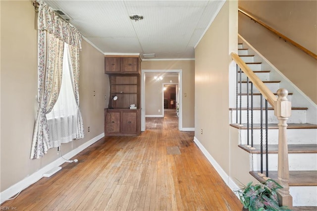 1040 Poquoson Ave, Poquoson, VA 23662 - foyer featuring hardwood / wood-style floors, stairway, crown molding, and baseboards