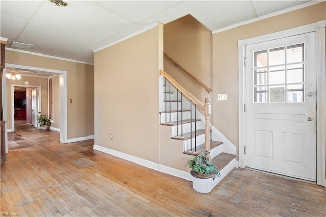 1040 Poquoson Ave, Poquoson, VA 23662 - foyer entrance featuring hardwood / wood-style floors, stairs, baseboards, and ornamental molding