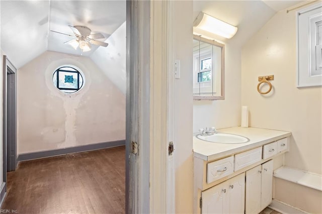 1040 Poquoson Ave, Poquoson, VA 23662 - bathroom featuring vaulted ceiling, vanity, wood finished floors, and a ceiling fan