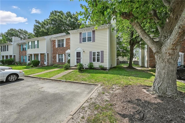 915 Spinnaker Ct, Chesapeake, VA 23320 - multi unit property with a front lawn, uncovered parking, and brick siding