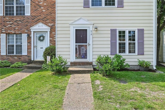 915 Spinnaker Ct, Chesapeake, VA 23320 - doorway to property with a yard and brick siding