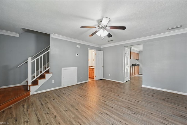 915 Spinnaker Ct, Chesapeake, VA 23320 - unfurnished living room featuring a ceiling fan, wood finished floors, crown molding, stairs, and baseboards