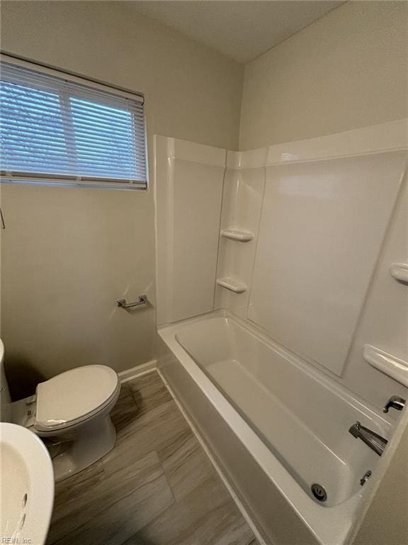 711 Vellines Ave, Chesapeake, VA 23324 - full bathroom with toilet, shower / bath combination, and baseboards