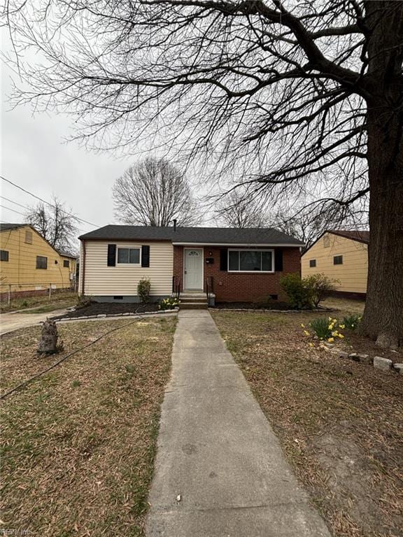711 Vellines Ave, Chesapeake, VA 23324 - ranch-style house featuring brick siding, a front lawn, and crawl space