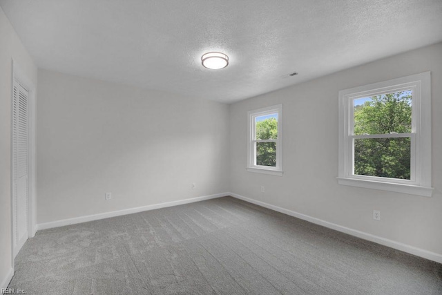 105 Londonderry Ln, Williamsburg, VA 23188 - unfurnished bedroom featuring a textured ceiling, baseboards, and carpet floors