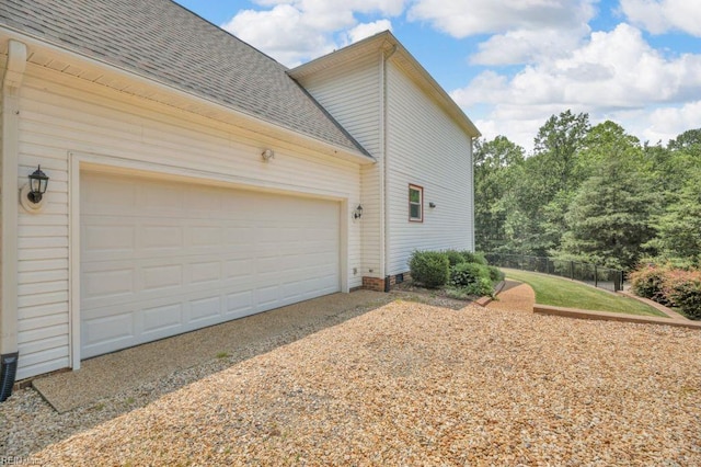 105 Londonderry Ln, Williamsburg, VA 23188 - view of property exterior with a shingled roof, gravel driveway, and a garage