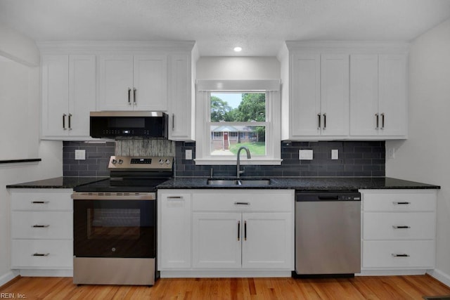 105 Londonderry Ln, Williamsburg, VA 23188 - kitchen featuring appliances with stainless steel finishes, a sink, and white cabinets