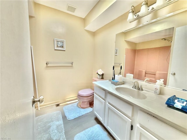 1736 Lockard Ave, Chesapeake, VA 23320 - bathroom with a shower, toilet, vanity, and wood finished floors